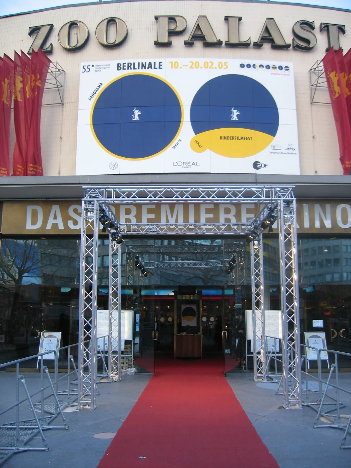 Red carpet and crowd at the entrance of a film festival premiere cinema